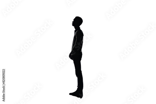 Silhouette of a standing person on a transparent background. captured in profile  representing contemplation and solitude.