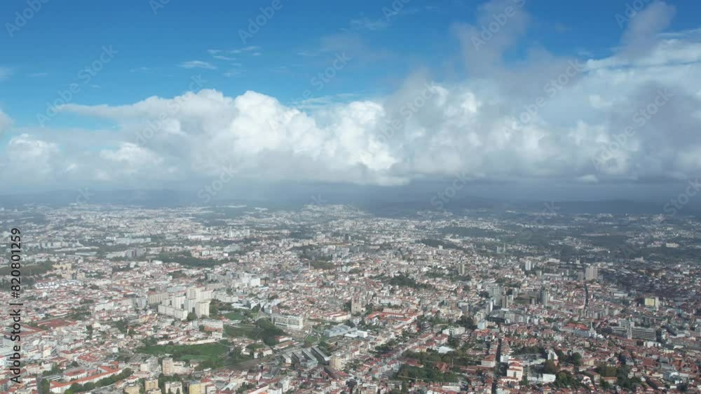 Time-lapse view of moving clouds above a cityscape during daytime Time-lapse view of moving clouds above a cityscape during daytime