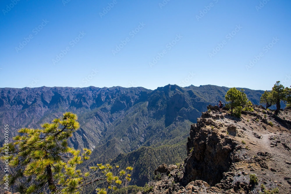 Young woman summit to Bejenado Peak in Caldera de Taburiente, La Palma, Spain Young woman summit to Bejenado Peak in Caldera de Taburiente, La Palma, Spain
