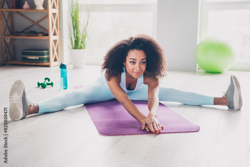 Photo of happy smiling lady activewear enjoying stretching back practicing sports indoors room home house Photo of happy smiling lady activewear enjoying stretching back practicing sports indoors room home house