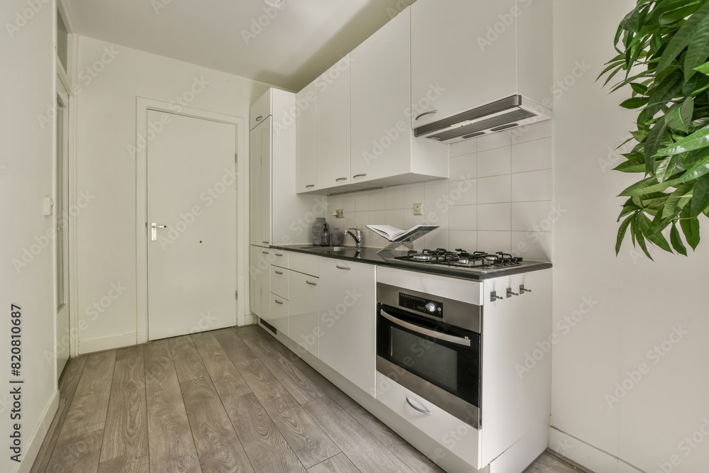 Modern kitchen interior at Stadionkade 16 with white cabinets Modern kitchen interior at Stadionkade 16 with white cabinets