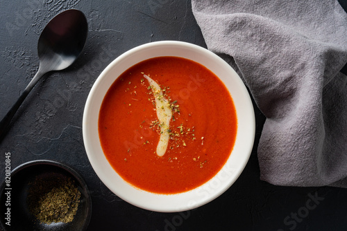 Delicious tomato soup with cheddar cheese	