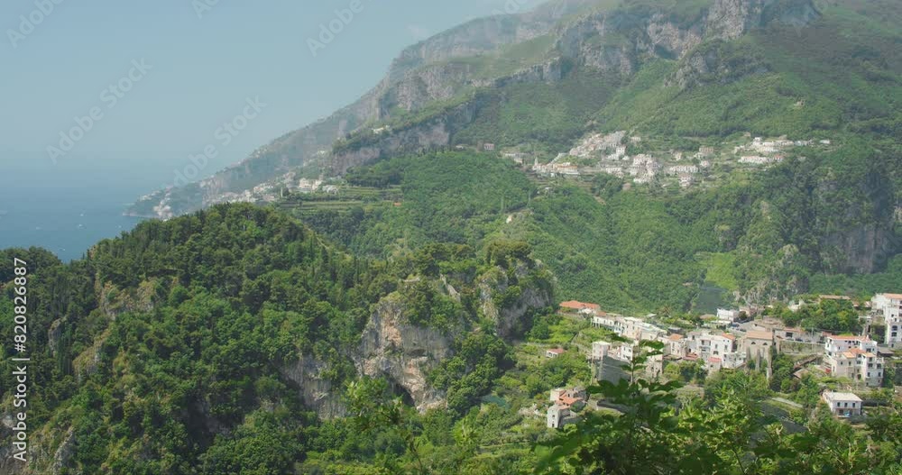 Scenic view of the lush Amalfi Coast from a high vantage point. Scenic view of the lush Amalfi Coast from a high vantage point.