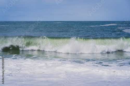 Wave on the beach of Nazar   on a spring day in late May.