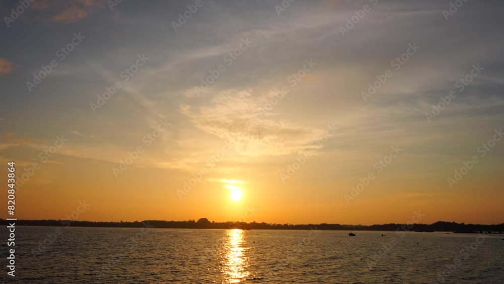 beautiful timelapse of sunrise with cloudy day ; calming ocean with beautiful sunrise beautiful timelapse of sunrise with cloudy day ; calming ocean with beautiful sunrise