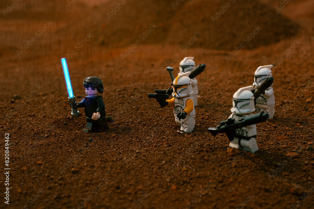 Obraz premium Depok, Indonesia - May 17, 2024: Lego toys photography, Anakin skywalker and phase 1 clone troopers on battle of geonosis recreation, during sandstorm
