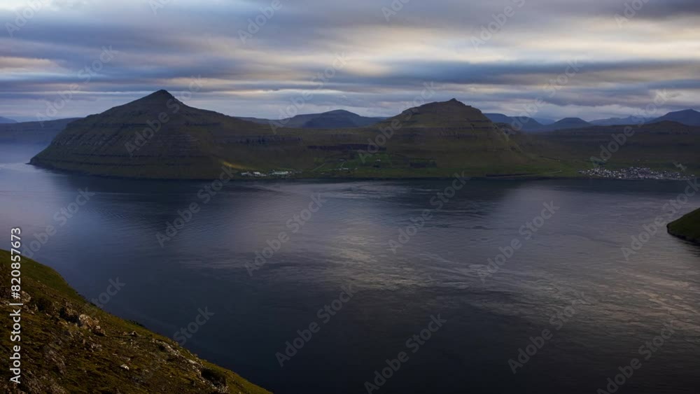 Time lapse in Faroe islands - Klakkur peak, Denmark, Europe. Colorful evening seascape of Atlantic Ocean. Time lapse in Faroe islands - Klakkur peak, Denmark, Europe. Colorful evening seascape of Atlantic Ocean.