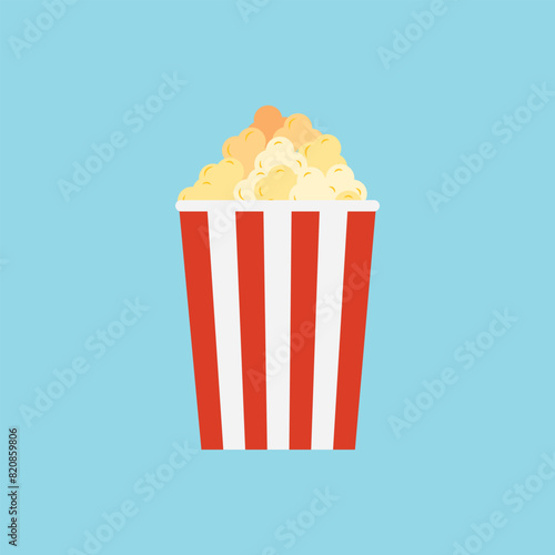 Popcorn bucket on green background. movie snack. cinema concept.