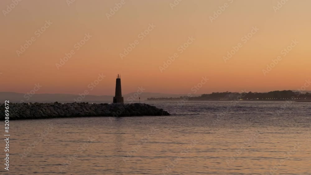Solitary Lighthouse at Dusk on a Calm Sea Solitary Lighthouse at Dusk on a Calm Sea