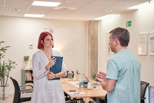 couple talking in a modern office 