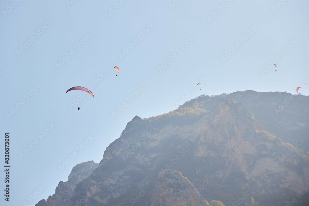 The sport of paragliding. Parachuting over high mountains. Beautiful natural landscape. The sport of paragliding. Parachuting over high mountains. Beautiful natural landscape.