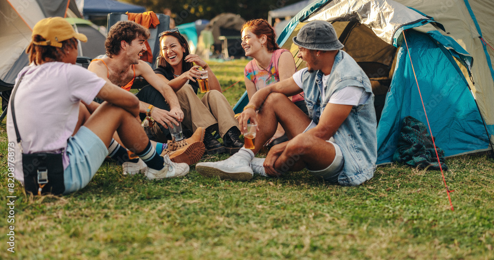 © Jacob Lund - Youngsters come together at a festival camp, drinking refreshing beers and sharing moments of laughter