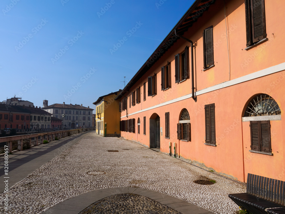 Fototapeta premium Gaggiano, Milan Italy: exterior of historic houses along the Naviglio Grande