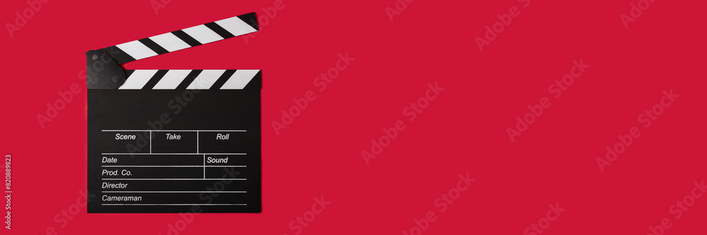 Cinema clapperboard on a red background, copy space, film, producer, Hollywood.