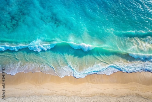 Wallpaper Mural The concept of rest and travel. Beautiful background. Top view of the white sand beach and the rolling foamy wave of the turquoise ocean. Torontodigital.ca