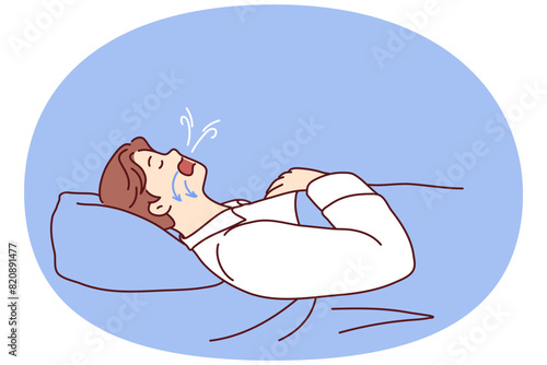 Man dozing on back in bed snores and has problems during obstructive sleep apnea. Guy suffering from obstructive sleep apnea with arrows on face pointing to airways that promote snoring photo