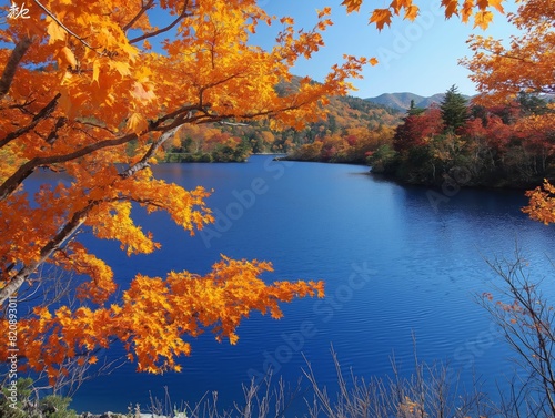 A beautiful lake with a blue sky and orange leaves on the trees. The lake is calm and peaceful  and the orange leaves add a warm and inviting atmosphere to the scene