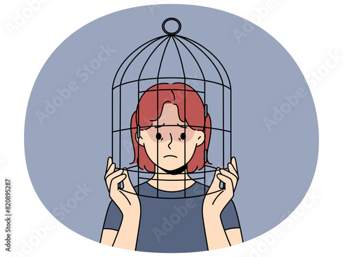Unhappy teenager girl with head in birdcage suffer from discrimination and lack of freedom. Upset teen child locked in cage struggle with psychological problems. Vector illustration.
