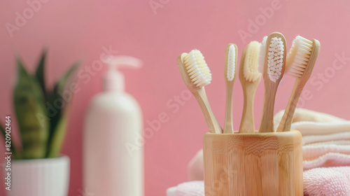 Tooth brushes with bath supplies on color background -