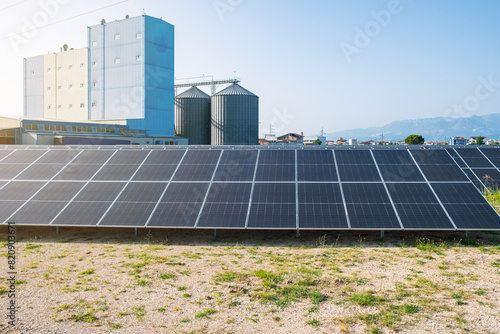 Solar photovoltaic panels in solar farm used to produce mill in a flour mill in Tirana, Albania. Sustainable energy, electric power generation, decarbonization, renewable green energy