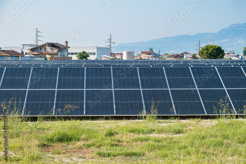 Solar photovoltaic panels in solar farm used to produce mill in a flour mill in Tirana, Albania. Sustainable energy, electric power generation, decarbonization, renewable green energy
