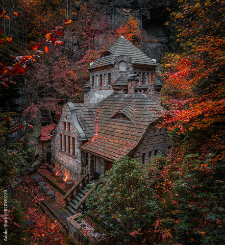 Hresko, Czech Republic - Lovely stone cottage in the Czech woods near Hresko at autumn with colorful fall leaves and foliage
