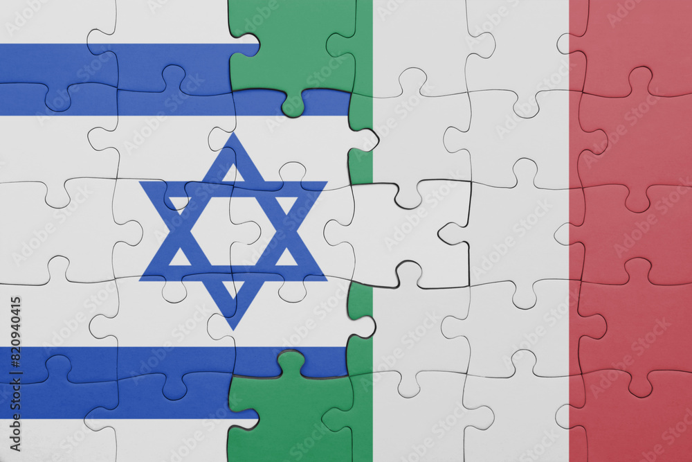 puzzle with the colourful national flag of italy and flag of israel ...