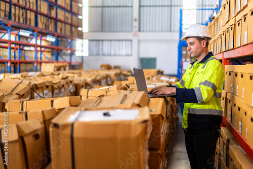 Portrait engineer worker labor man shipping transportation ship loading move inventory cardboard boxes in factory distributions warehouse at logistics center.logistic industry business import export