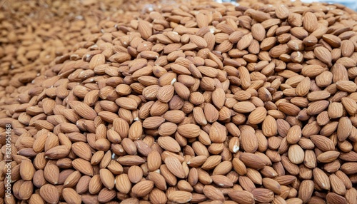 Nutty Display: Raw Peeled Almonds Scattered Arbitrarily