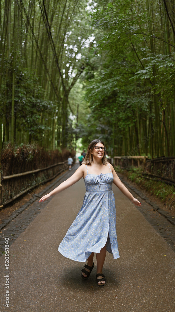 Cheerful hispanic woman in glasses spins around, her beautiful dress flowing in kyoto's enchanting bamboo forest Cheerful hispanic woman in glasses spins around, her beautiful dress flowing in kyoto's enchanting bamboo forest