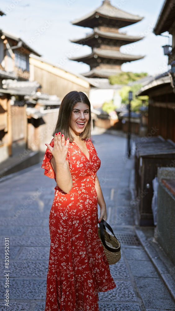 Radiant beautiful hispanic woman confidently invites with friendly waving gesture, asking to come join her in quaint wooden streets of gion, kyoto's old traditional town.
