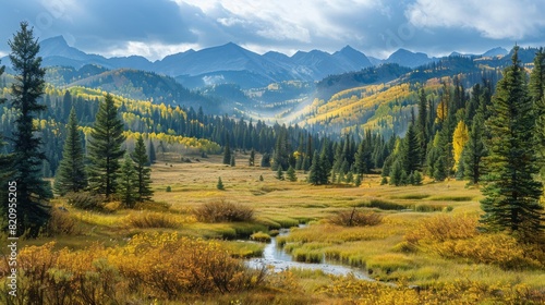A tranquil landscape with golden autumn trees, a flowing creek, and distant mountains under a soft, cloudy sky