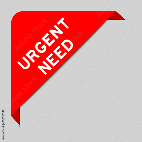 Red color of corner label banner with word urgent need on gray background