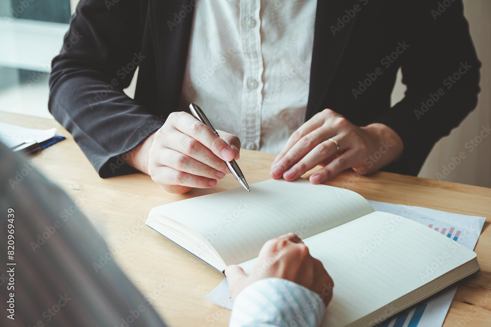 person signing an important business document, showcasing cooperation and legal consent, highlighting the significance of formal agreements and the role of paperwork in insurance and health matters. person signing an important business document, showcasing cooperation and legal consent, highlighting the significance of formal agreements and the role of paperwork in insurance and health matters.