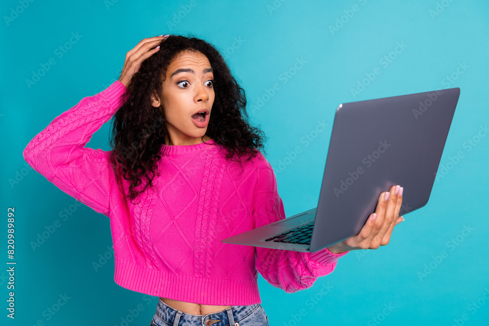 Photo portrait of attractive teen girl hold netbook amazed touch head dressed stylish pink clothes isolated on aquamarine color background Photo portrait of attractive teen girl hold netbook amazed touch head dressed stylish pink clothes isolated on aquamarine color background
