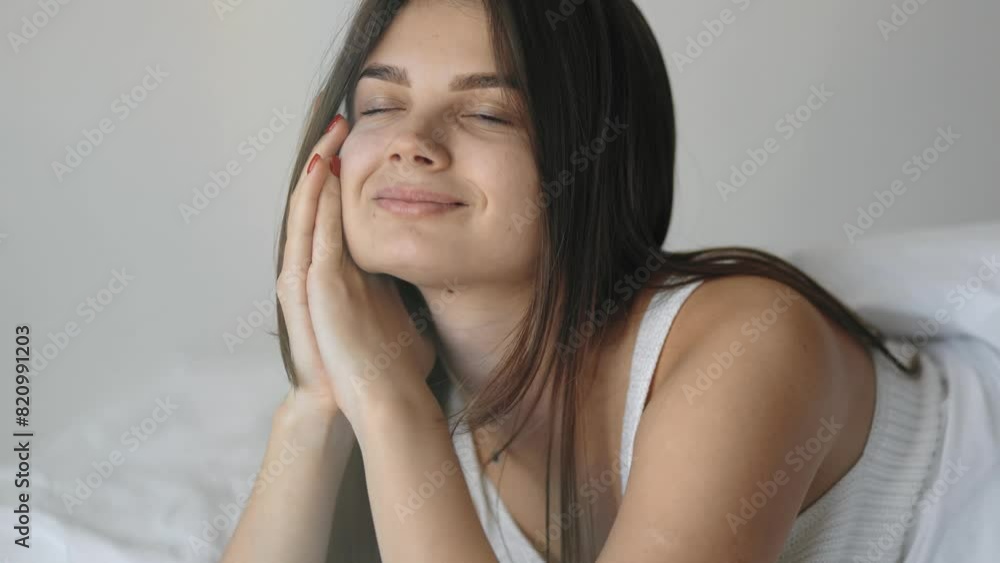 Portrait of a beautiful girl, model, student, who gently poses on a pillow in linen and bed, morning light and stretching, tenderness and purity, softness, morning, awakening, smile, napping, relax Portrait of a beautiful girl, model, student, who gently poses on a pillow in linen and bed, morning light and stretching, tenderness and purity, softness, morning, awakening, smile, napping, relax