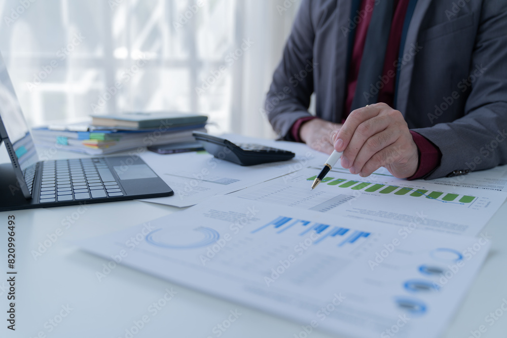 Business Documents concept : Employee woman hands working in Stacks paper files for searching and checking unfinished Business Documents concept : Employee woman hands working in Stacks paper files for searching and checking unfinished