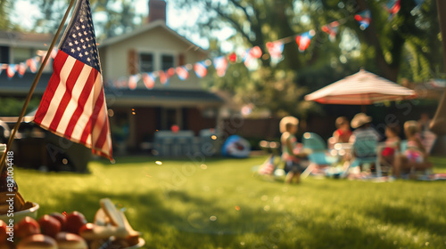 American flag on a patio full of guests enjoying a Memorial Day barbecue, children playing in the background. American family and friends celebrating the 4th of July, Independence Day. Copy space. photo