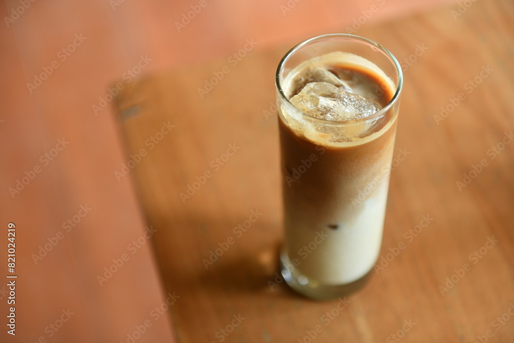 Iced coffee milk with palm sugar on wooden table. Iced coffee milk with palm sugar on wooden table.