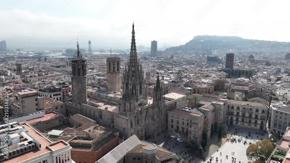 Aerial view of Catedral de Barcelona, Santa Creu i Santa Eulàlia is a gothic cathedral surrounded by residential buildings. Tourist monument in Ciutat Vella district. Aerial view of Catedral de Barcelona, Santa Creu i Santa Eulàlia is a gothic cathedral surrounded by residential buildings. Tourist monument in Ciutat Vella district.