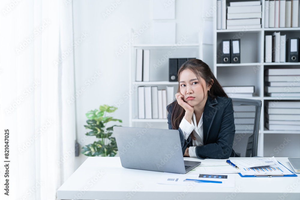 Stress at work, sitting with a stressed face, standing and stretching the body of an office woman. Stress at work, sitting with a stressed face, standing and stretching the body of an office woman.