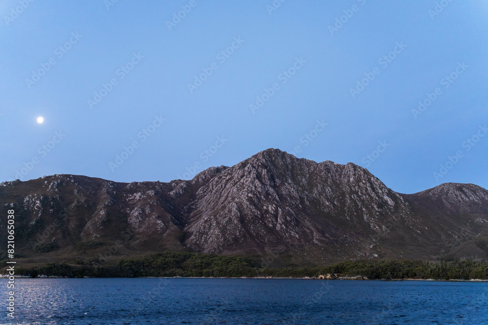 Beautiful Rocky Mountain over a lake in a beautiful park. Wilderness landscape with no people. Stunning bush and forest by the sea and ocean. Beautiful Rocky Mountain over a lake in a beautiful park. Wilderness landscape with no people. Stunning bush and forest by the sea and ocean.