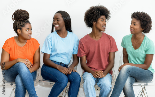 Group of african american male and female young adults waiting for a job interview