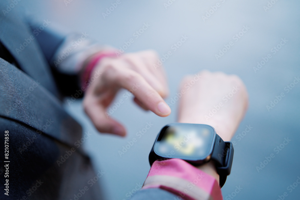 Business Person Checking Time on Stylish Smartwatch Business Person Checking Time on Stylish Smartwatch