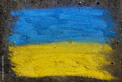 Flag of Ukraine. Chalk drawing on sidewalk. Creative support by children for Ukraine