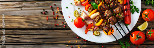 Shish kebab on the grill in a white plate with vegetables grilling recipes wooden table background
 photo