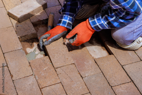 Reconstruction destroyed brick path refers to replacement broken portion of pavement.