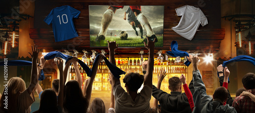 Victory Celebration. Soccer enthusiasts gather in pub to watch live match translation. Supporting football team. Concept of championship cup final, competition, game, tournament photo