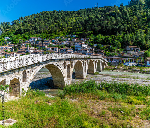 A view of the sunlight illuminating the side of the Gorica bridge in Berat, Albania in summertime