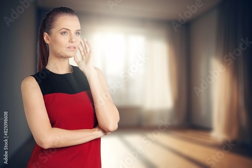 Happy young woman poses playfully